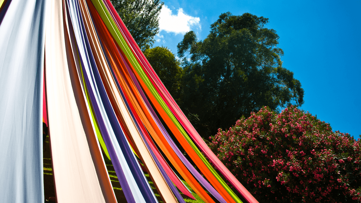 Colored ribbons descending from a maypole in honor of May Day