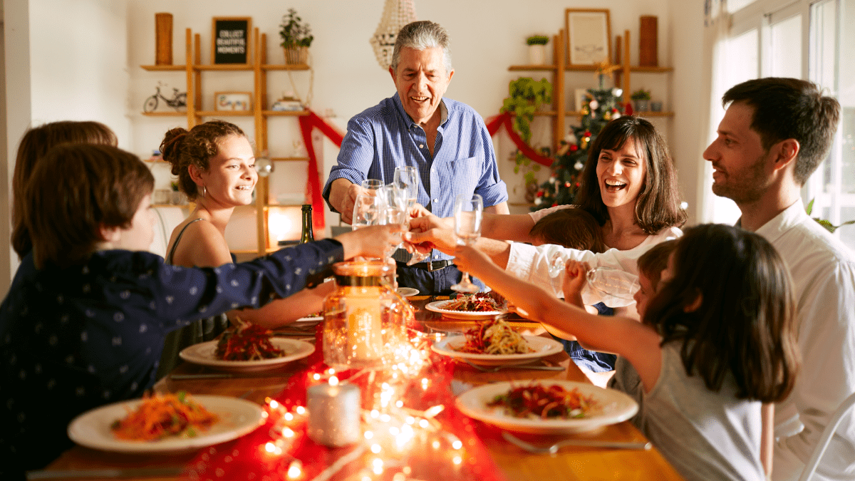 Latin American Christmas Traditions represented by a family gathered around a holiday feast